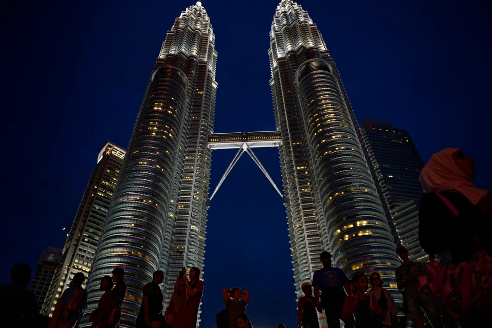 The Petronas Twin Towers in Kuala Lumpur, Malaysia, where the country's stock exchange has its headquarters. 
