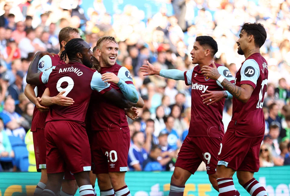 West Ham players celebrating after scoring the first goal against Brighton in an EPL match on Aug 27. The Hammers won 3-1.