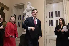 US House Speaker Mike Johnson (centre) defended the deal late on Sunday, saying it eliminates the “worst” budget gimmicks and paves the way for passage of spending measures. 