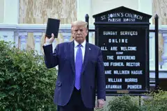 File photo of then-US President Donald Trump holding up a Bible outside of St John's Episcopal church in Washington, DC on June 1, 2020. Trump reposted a news article titled, “The Crucifixion of Donald Trump” - only the latest in a series of references made or disseminated by Trump in which he is compared to Christ.