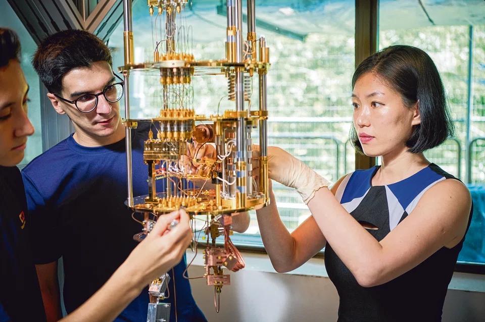 Researchers at the Centre for Quantum Technologies examine the cooling system for a superconducting quantum circuit, a technology that could pave the way for large-scale quantum computers