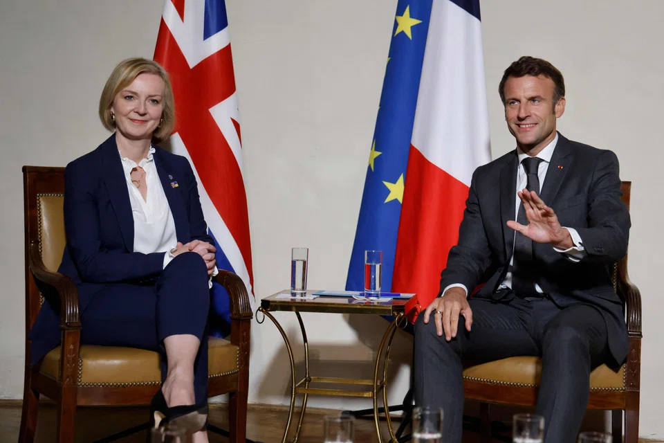 French President Emmanuel Macron and Britain's Prime Minister Liz Truss meet at the Prague castle where the European Summit will take place in Prague, Czech Republic,  Oct 6, 2022. 