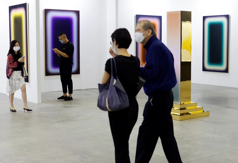 Visitors tour the exhibits during a VIP preview of the ART SG art fair in Singapore.