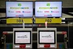 Screens promoting the use of green hydrogen at an airport in Santiago. Major oil companies still spend the bulk of their money on oil and gas, but are devoting a growing proportion to low-carbon energy.