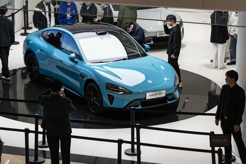 A Xiaomi SU7 electric vehicle on display at one of the company's stores in Shanghai, China, March 26, 2024. With a year-long EV price war going on in China, reception for the SU7 will likely dictate Xiaomi’s stock momentum after a 22 per cent gain since a February low.  