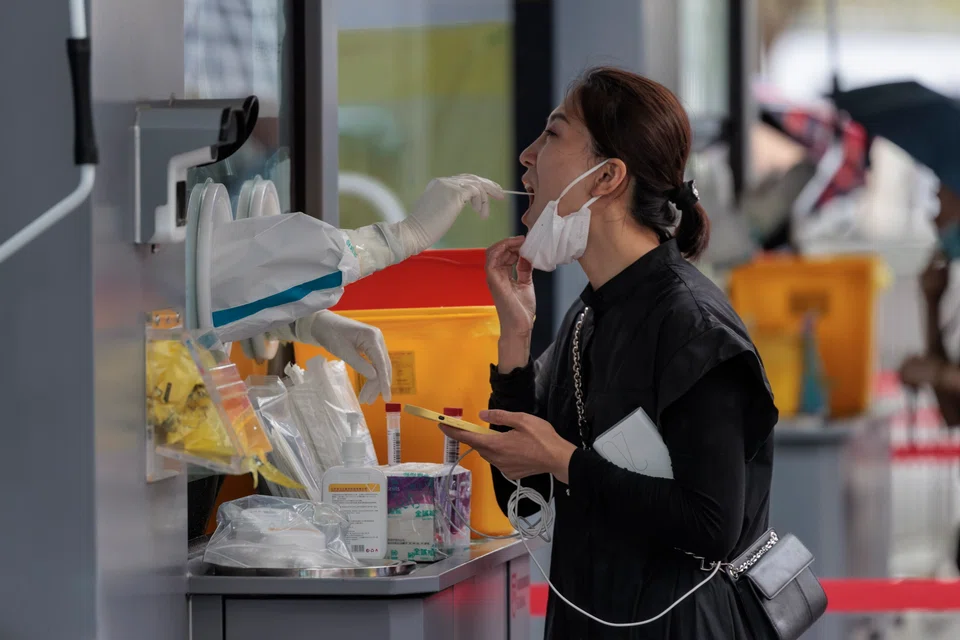 Shanghai residents are required to take at least one PCR test each week until the end of October.