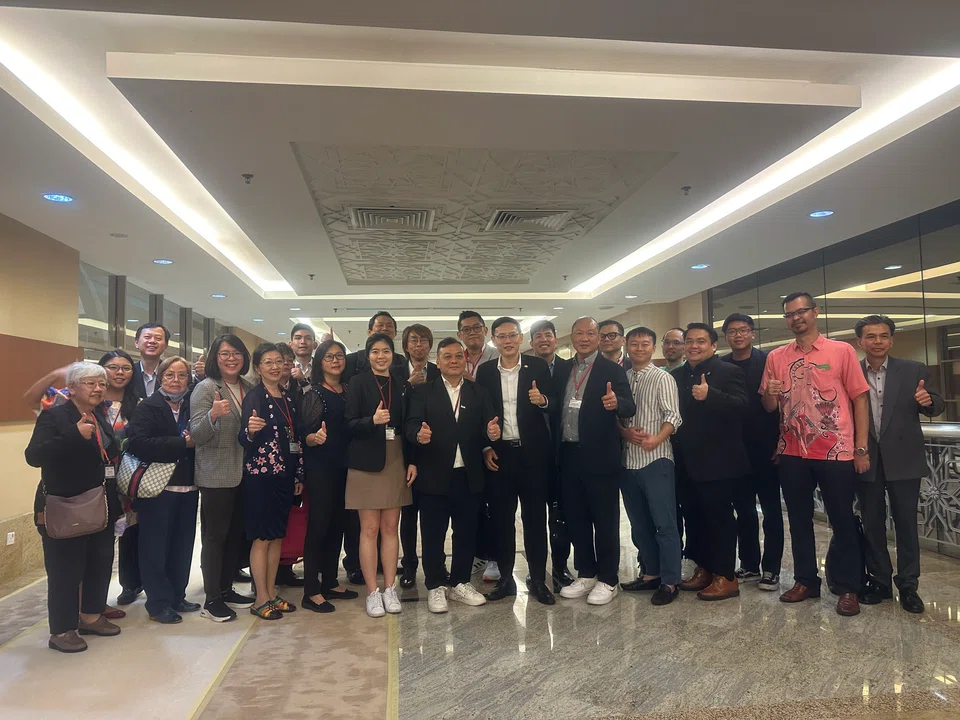 Delegates with the State Investment, Trade and Consumer Affairs Committee chairman Lee Ting Han at Johor state administration centre.