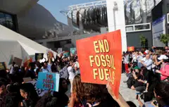 Climate activists protest against fossil fuels at Dubai's Expo City during the United Nations Climate Change Conference COP28 in Dubai, United Arab Emirates.