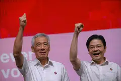 Prime Minister Lee Hsien Loong (left) and PAP Deputy Secretary General Lawrence Wong at the PAP Awards and Convention at Singapore Expo on November 5, 2023.