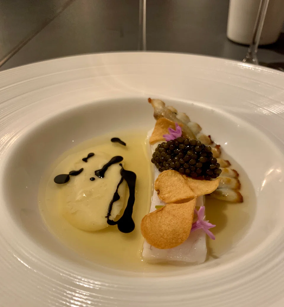 Steamed turbot in its own broth, thickened with aioli.