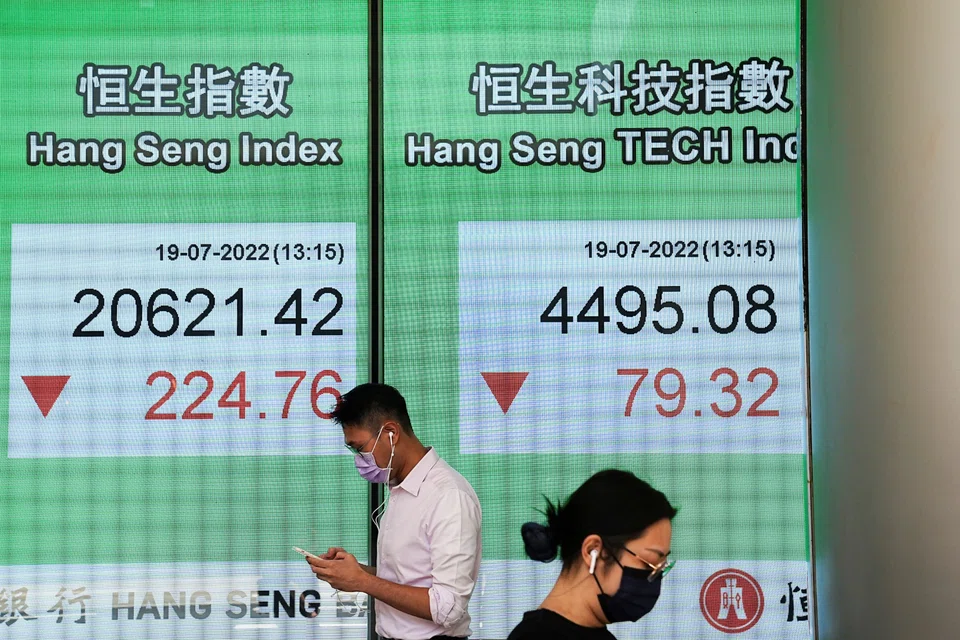 A screen displaying the Hang Seng stock index in Hong Kong's Central district. On Monday (Oct 10), the index shed 2.95 per cent, or 523.39 points, to 17,216.66.