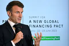French President Emmanuel Macron announces that the US$100-billion climate finance pledge has been finalised.