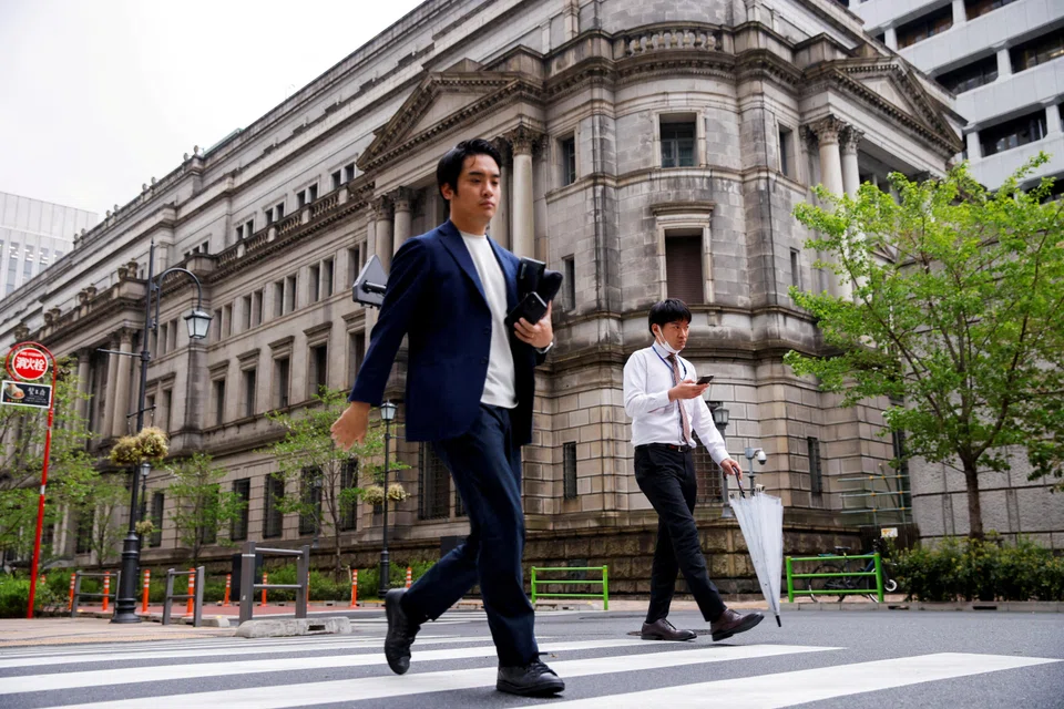Under its massive stimulus programme, the Bank of Japan currently guides short-term interest rates at minus 0.1 per cent, caps the 10-year government bond yield around 0 per cent and continues to buy huge amounts of assets such as government bonds.