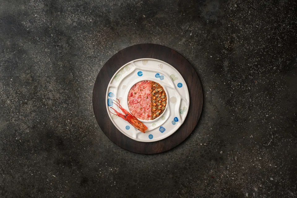 Raw and Cooked features carabinero prawn crudo, prawn floss and crispy prawn head.