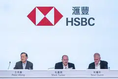 Mark Tucker (centre) told shareholders a restructuring or spin-off of its Asia business would create a major period of uncertainty for clients, and employees and shareholders would be disrupted.