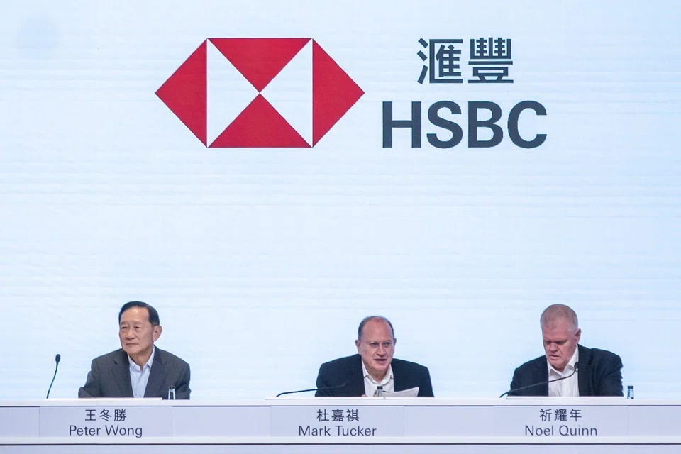 Mark Tucker (centre) told shareholders a restructuring or spin-off of its Asia business would create a major period of uncertainty for clients, and employees and shareholders would be disrupted.