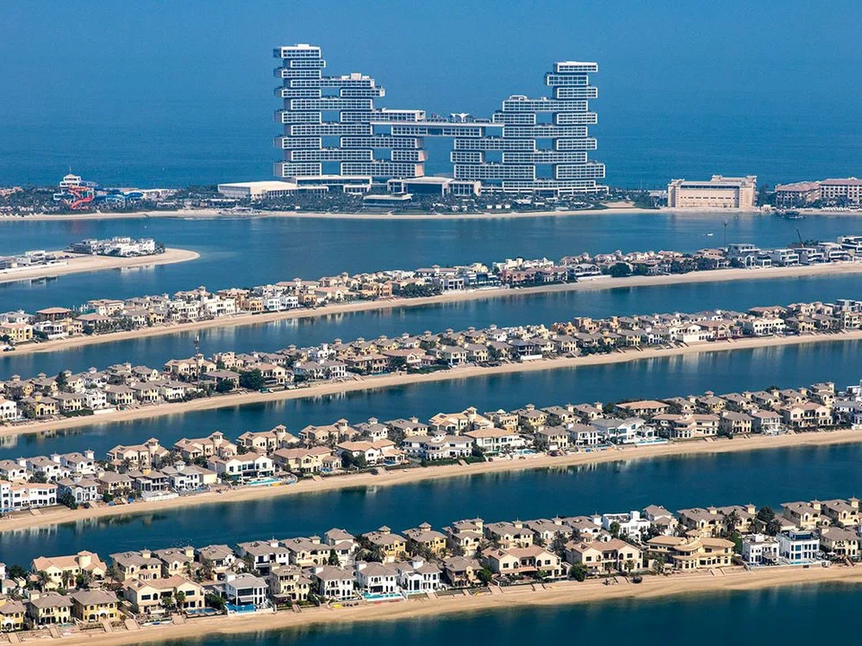 Dubai's new Atlantis The Royal resort in the background, with views of villas on the waterside of the Palm Jumeirah.