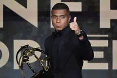 PSG's French forward Kylian Mbappe gives a thumbs up after receiving the Best Ligue 1 Player award during the 31th edition of the UNFP (French National Professional Football players Union) trophy ceremony in Paris, May 28, 2023. 