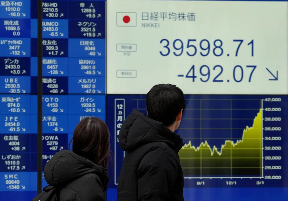 Japanese equities were weighed by a tech sell-off after losses for the sector in New York, while exporters also took a hit from a stronger yen as reports said the country’s central bank was considering shifting away from its ultra-loose monetary policy soon.