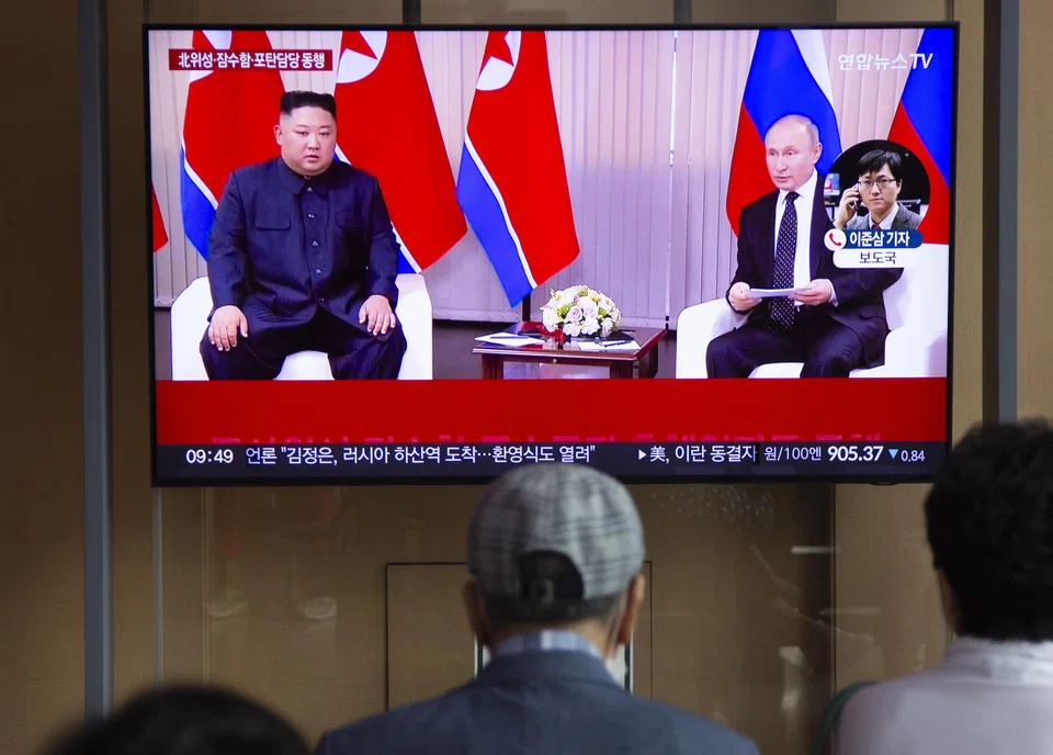 People watch a news segment detailing North Korean leader Kim Jong-un's visit to Russia at a train station in Seoul, South Korea, Sept 12, 2023. 