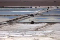 Brine pools of Albemarle's lithium plant in Chile. Prices of lithium, a key ingredient in electric vehicle batteries, have halved from a peak late last year, leading to a drop in share values for some miners, and fuelling a surge of deal activity.