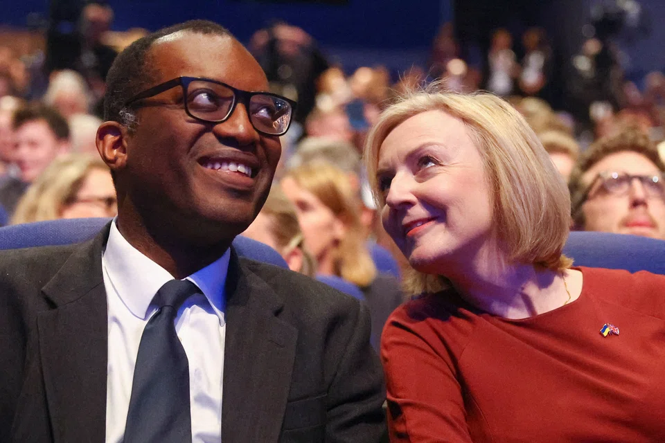 British Prime Minister Liz Truss and Finance minister Kwasi Kwarteng attend the annual Conservative Party conference in Birmingham, Britain, on Sunday (Oct 2).  Kwateng said the decision to scrap the top rate tax cut had been taken with “some humility and contrition”.