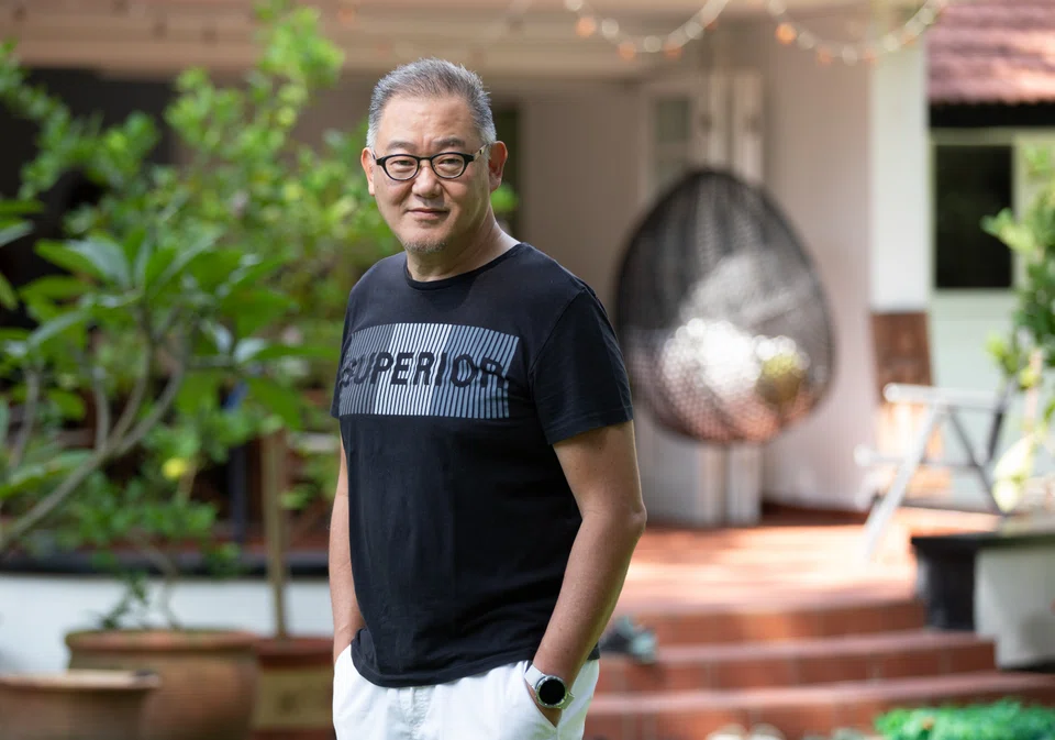 TJ Thang's black-and-white bungalow sits on some 30,000 square feet of land. 