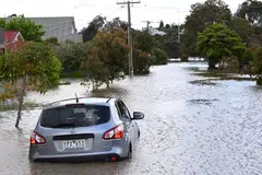 A submerged car is seen in flood waters in Maribyrnong, Melbourne, Australia, Oct 14, 2022. 