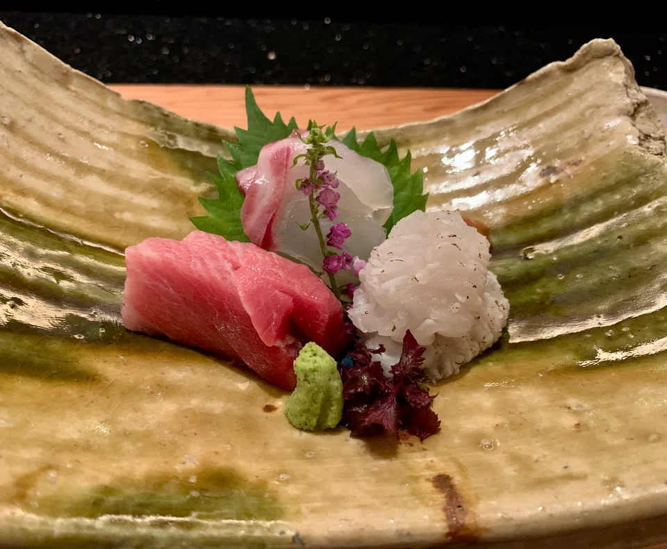 Bincho-kissed anago is the star of the sashimi platter.