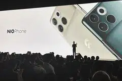 William Li, founder and chief executive officer of Chinese electric vehicle maker Nio, unveils the Nio Phone during a launch event for the company's first mobile phone in Shanghai.