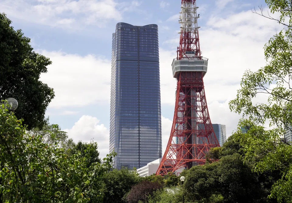 At 330 metres, the Mori JP Tower (left) anchoring the Azabudai Hills project is just slightly shorter than the iconic orange and white Tokyo Tower nearby.
