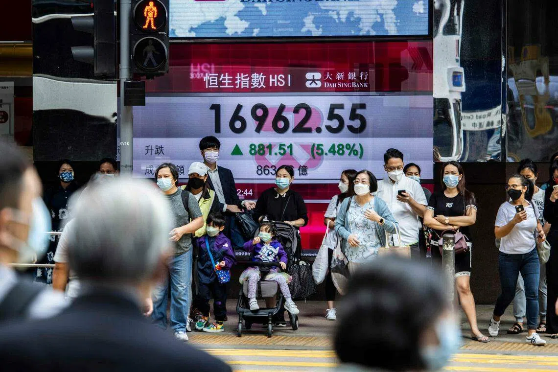 The Hang Seng index in a Hong Kong street on Nov  11. “The worst is already priced in, and you’ve got plenty of upside for Chinese equities”, said Bill Maldonado, chief investment officer at Eastspring in Singapore.