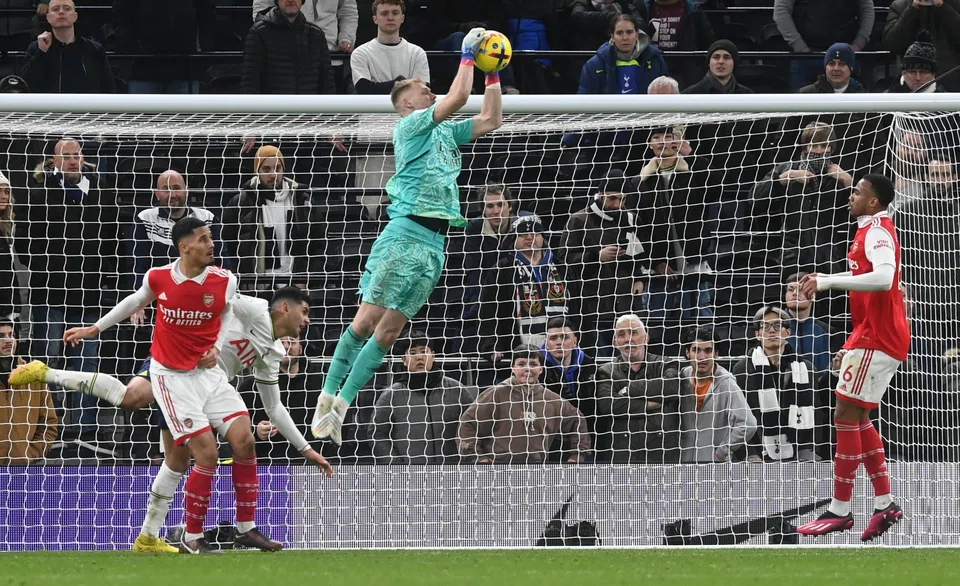Goalkeeper Aaron Ramsdale of Arsenal makes a save during the English Premier League football match between Tottenham Hotspur and Arsenal in London, Britain, Jan 15, 2023.  