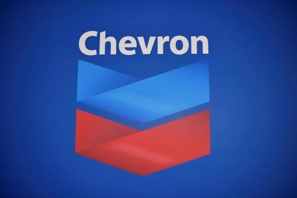 Despite the nearly 40 per cent fall in annual profit, Chevron announces it would increase its dividend by 8 per cent in a sign of confidence. 