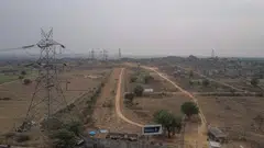 Power lines and transmission towers at the site for Pharma City in Hyderabad, India. The blackouts were sparked by the scarcity of coal - the fossil fuel that accounts for 70 per cent of India’s electricity generation.