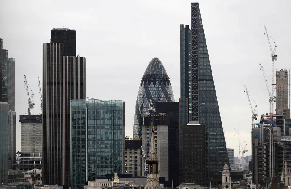 FILE PHOTO:   London financial district. Basic resources led gains in the Stoxx Europe 600 index as copper surged to its highest since April, with sentiment across industrial metals bolstered by China’s gradual re-opening. The UK benchmark climbed more than 1 per cent as traders returned after a 4-day break. 