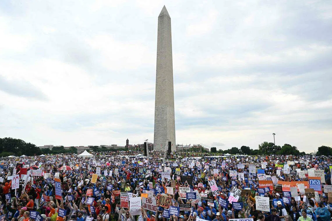 Thousands of gun control advocates protest against gun violence during a rally near the Washington Monument on the National Mall in Washington, DC, June 11, 2022.