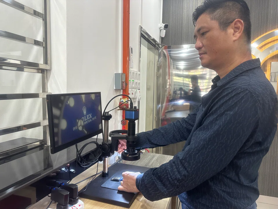 CSM Pawn Shop director Mark Chan is checking the authenticity of one of the watches. Branded watches are one of the most popular and widely accepted pledges by pawn shops in Malaysia.