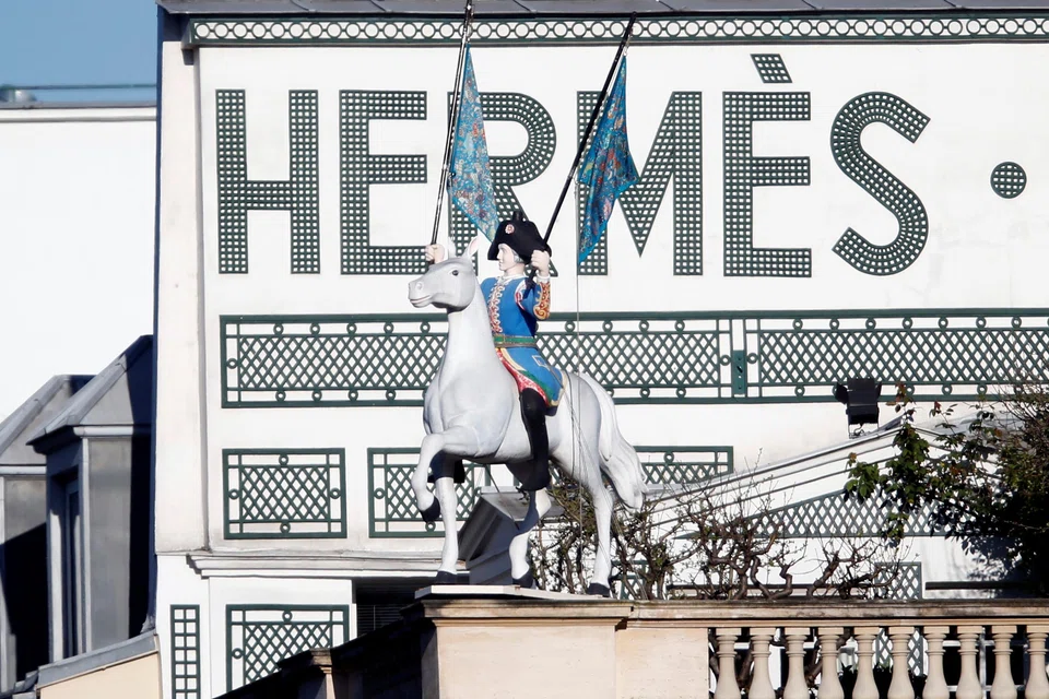 Hermes is defying a broader slump in the high-end goods market as its exposure to the ultra-rich shields it from the worst of the lull. 
