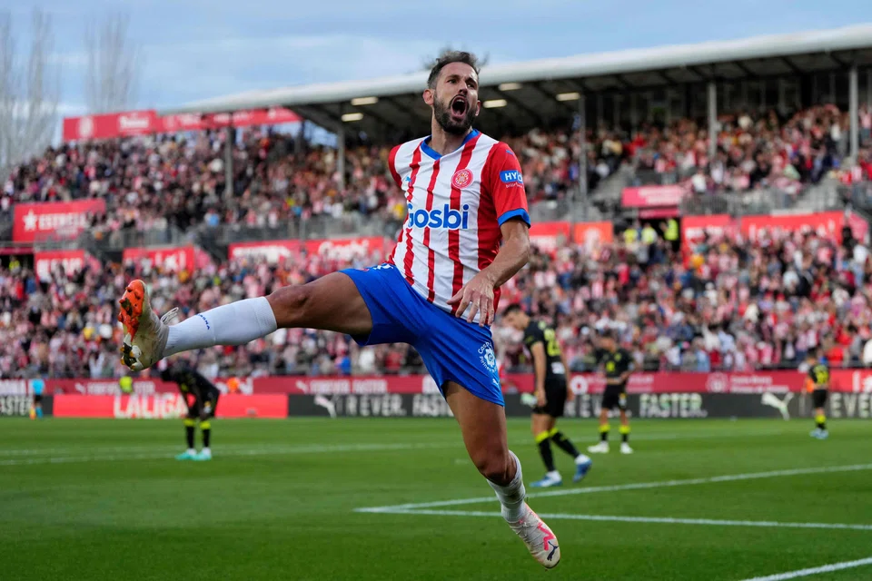 Girona's Uruguayan forward Cristhian Stuani is the club's all-time top scorer with 226 goals. Here he is seen celebrating scoring against Almeria on Oct 22.
