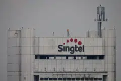 Singtel's net profit for the third quarter falls  12.5 per cent to S$465 million due to a higher net exceptional loss.