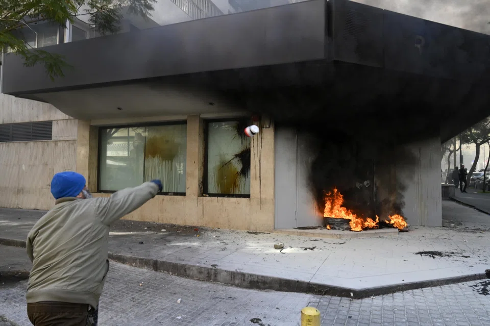 Lebanese depositors attacked banks in a Beirut neighbourhood on Thursday (Feb 19), in a protest against informal restrictions on cash withdrawals that have been in place in 2019. To gain access to their funds, stuck in the country's banking sector, depositors resort to lawsuits and, often, force.