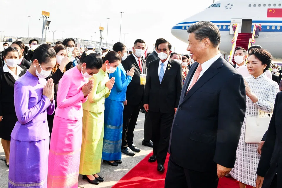 China's President Xi Jinping and his wife Peng Liyuan being greeted by Thailand's Prime Minister Prayut Chan-o-Cha upon their arrival in Bangkok for the Asia-Pacific Economic Cooperation (Apec) summit on Thursday (Nov 17).