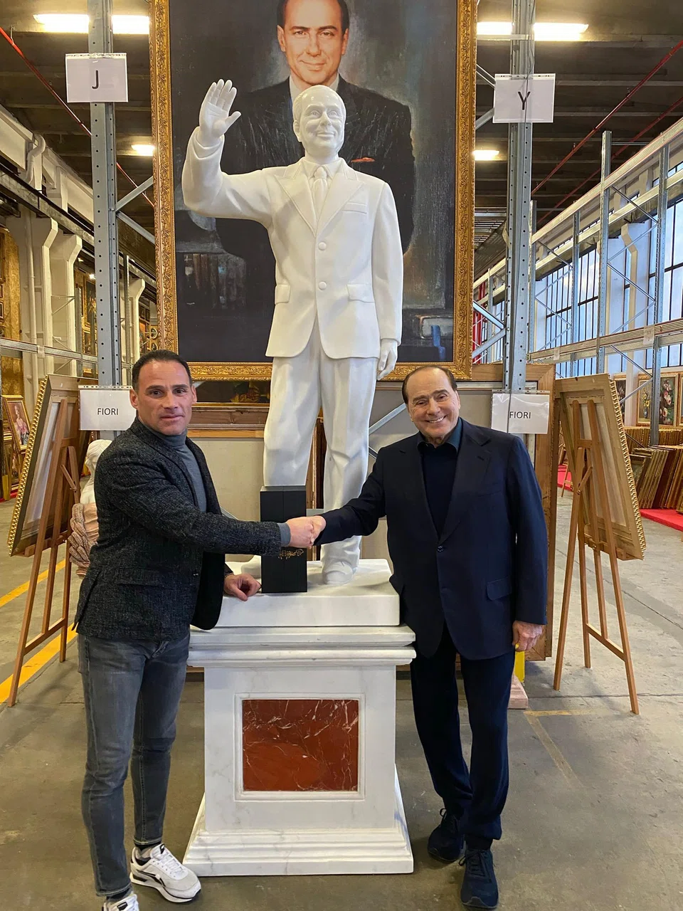 Televendor Giuseppe De Gregorio (left), with Silvio Berlusconi, says: "(Berlusconi) had this project to build the largest collection in Italy. He didn’t want important paintings. He wanted paintings. It was enough if they were painted with oil on a canvas.”