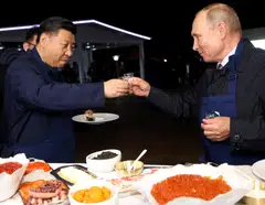 File photo of Vladimir Putin and President Xi Jinping meeting at the Eastern Economic Forum in Vladivostok, Russia 2018; the 2 leaders are deepening ties  with trade soaring by nearly a third between Russia and China in the first 7 months of 2022.