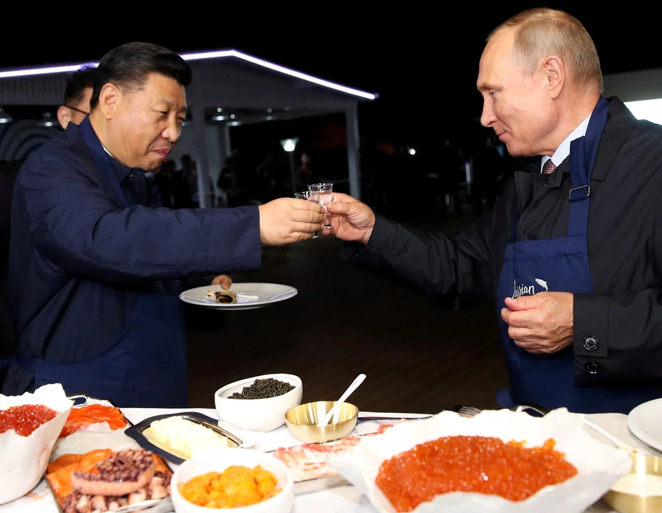 File photo of Vladimir Putin and President Xi Jinping meeting at the Eastern Economic Forum in Vladivostok, Russia 2018; the 2 leaders are deepening ties  with trade soaring by nearly a third between Russia and China in the first 7 months of 2022.
