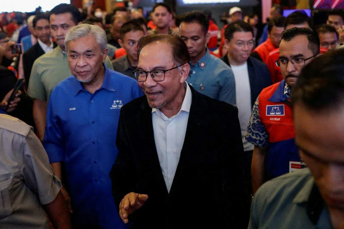 Malaysian PM Anwar Ibrahim leaving a press conference in Kuala Lumpur after the release of the state election results on Saturday.