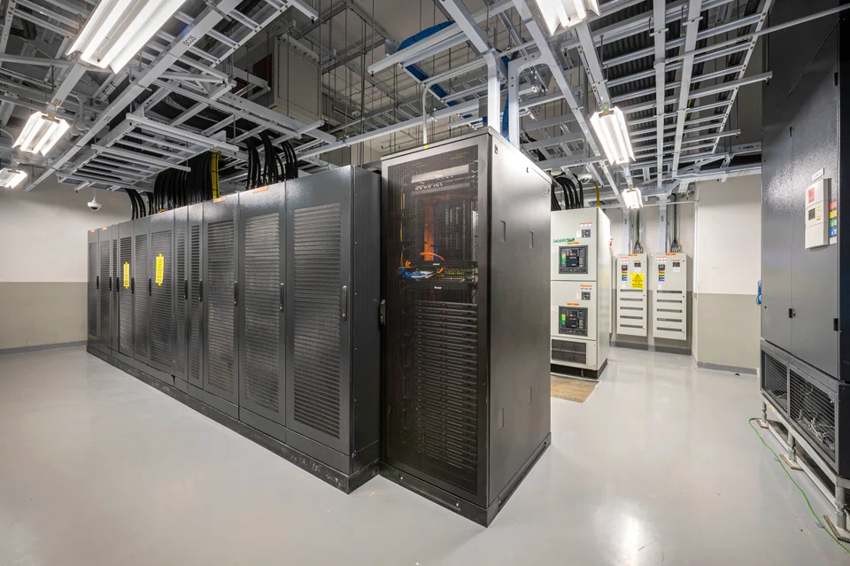 Cabinets holding data servers in Equinix's fifth data centre, SG5.  Leong Yee May, the managing director of Equinix South Asia, welcomed the increased capacity, given that larger data centres can benefit from economies of scale when employing advanced cooling techniques.