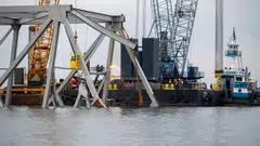 Demolition crews cut the top portion of the north side of the collapsed Francis Scott Key bridge into smaller sections for safe removal by crane in the Patapsco River, in Baltimore, Maryland, March 30, 2024. 