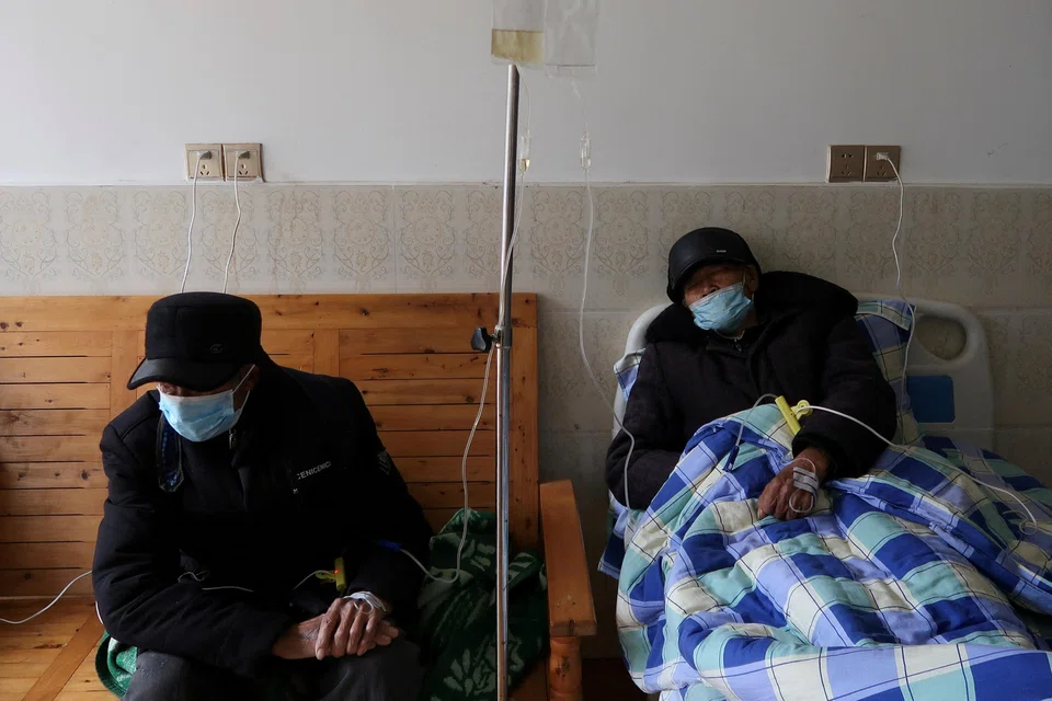 Tang Shunping, 80, receives IV drip treatment at a clinic in a village of Lezhi county after strict measures to curb Covid-19 were removed nationwide, in Ziyang, Sichuan province, China, Dec 29, 2022. 